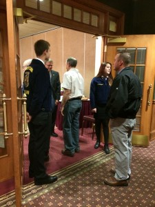 Austin Mueller and Heather Zeiset greeting farmers as they come to breakfast. 